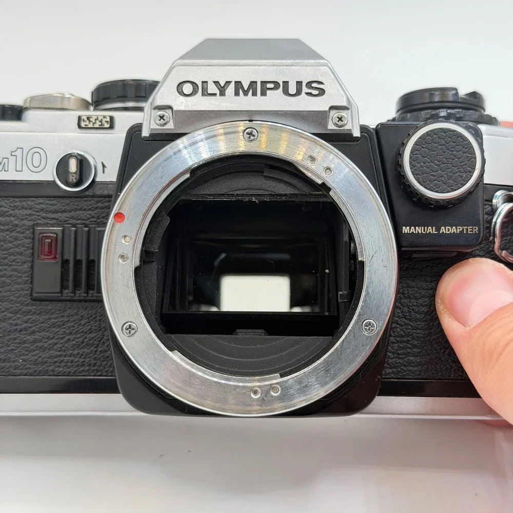 Olympus OM10 35mm Film SLR Camera Body Silver Black with Manual Adapter TESTED